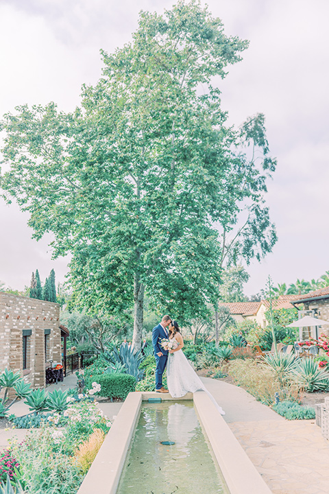  fun garden wedding with a traditional tea ceremony – couple by the pond