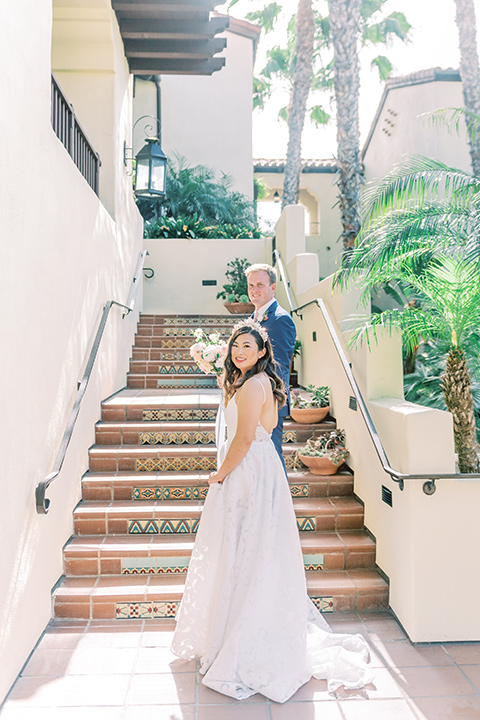  fun garden wedding with a traditional tea ceremony – couple walking up the stairs 