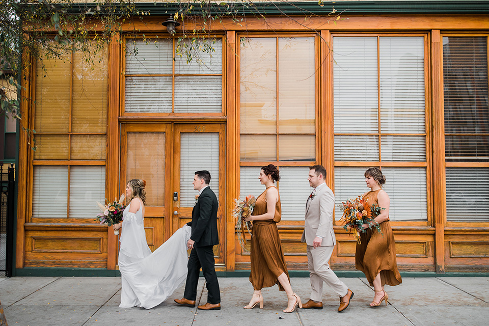  fall navy, green, and orange wedding – bridal party walking