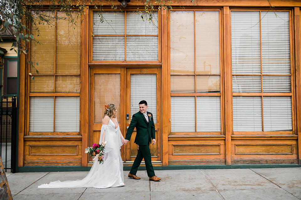  fall navy, green, and orange wedding – couple walking