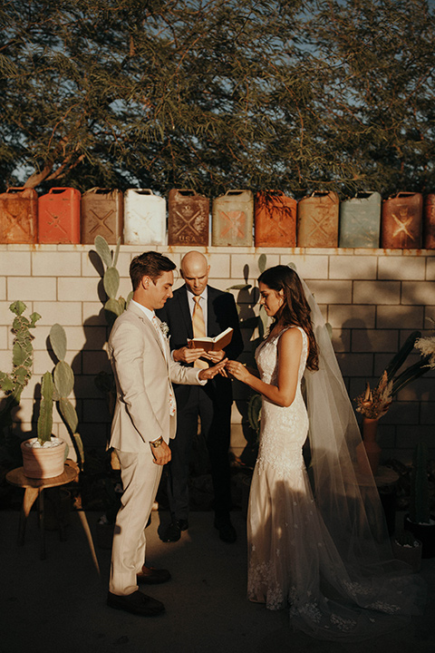  boho adventure elopement in Joshua tree, CA – saying the vows 