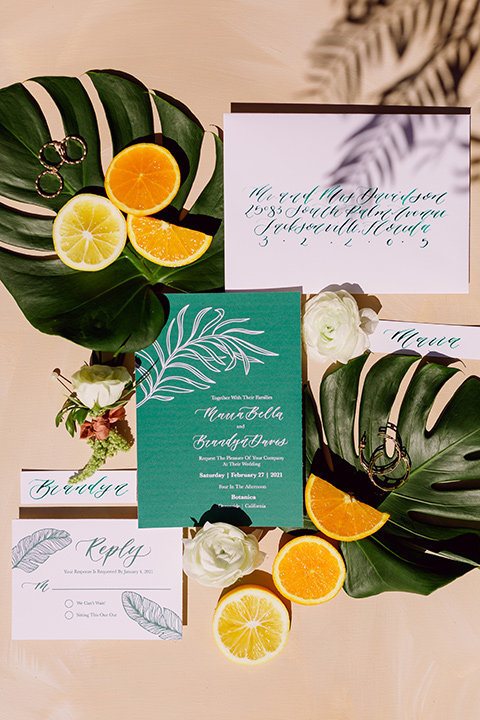  bohemian wedding with the bride in a flowing lace gown and the groom in a caramel brown suit with a green velvet bow tie- invitations