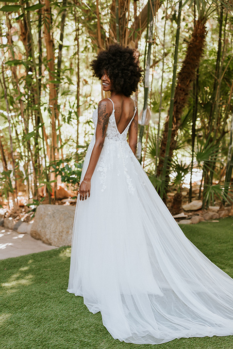  bohemian wedding with the bride in a flowing lace gown and the groom in a caramel brown suit with a green velvet bow tie- bride 