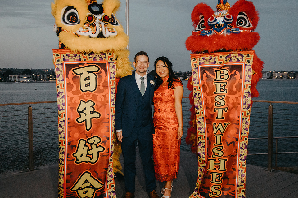  blue and red wedding- couple with lion dancers
