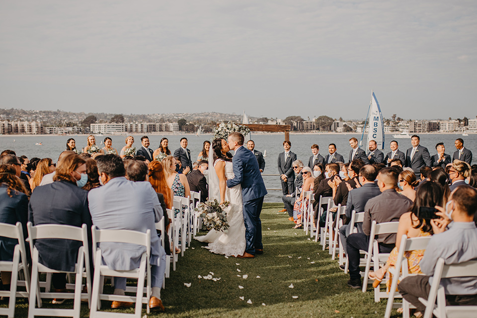  blue and red wedding- ceremony first kiss