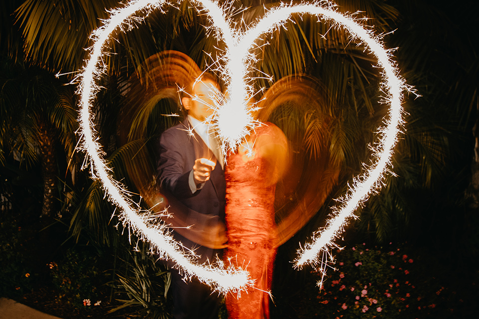  blue and red wedding- couple with sparklers