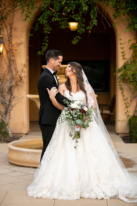  Iridescent dreams in the desert with the bride in a pink dress and the groom in a rose suit - bride