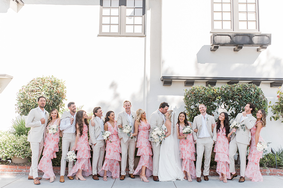  tan and pink garden wedding with floral bridesmaid dresses and the groom and groomsmen in tan suits - bridalparty 