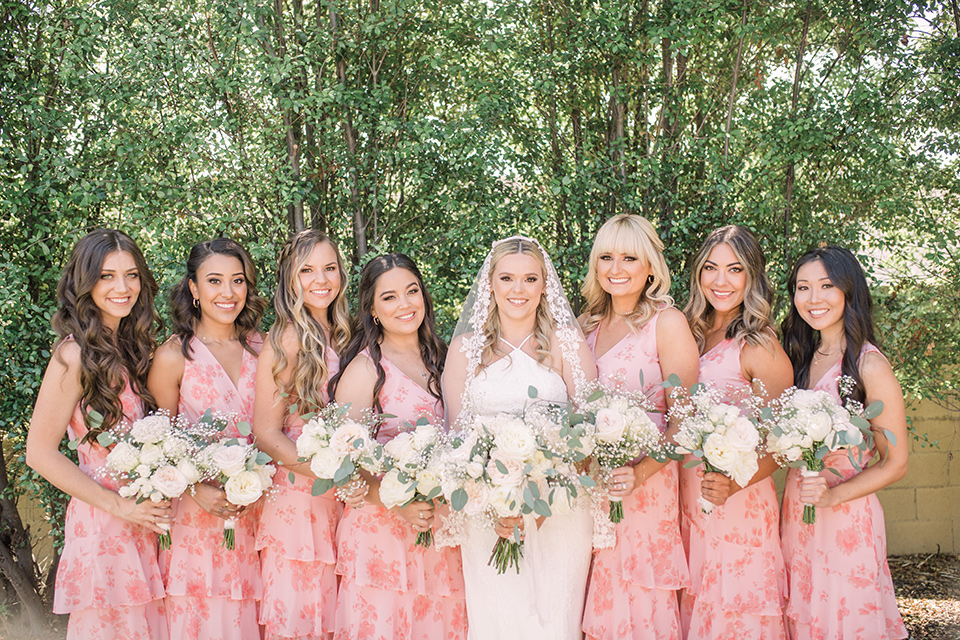  tan and pink garden wedding with floral bridesmaid dresses and the groom and groomsmen in tan suits - bridesmaids 