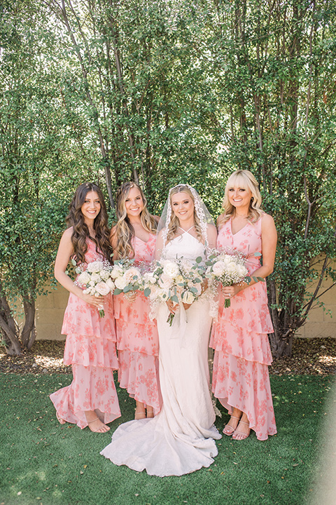  tan and pink garden wedding with floral bridesmaid dresses and the groom and groomsmen in tan suits – bridesmaids 