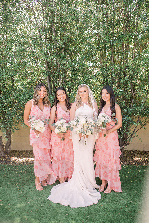  tan and pink garden wedding with floral bridesmaid dresses and the groom and groomsmen in tan suits – bridesmaids 