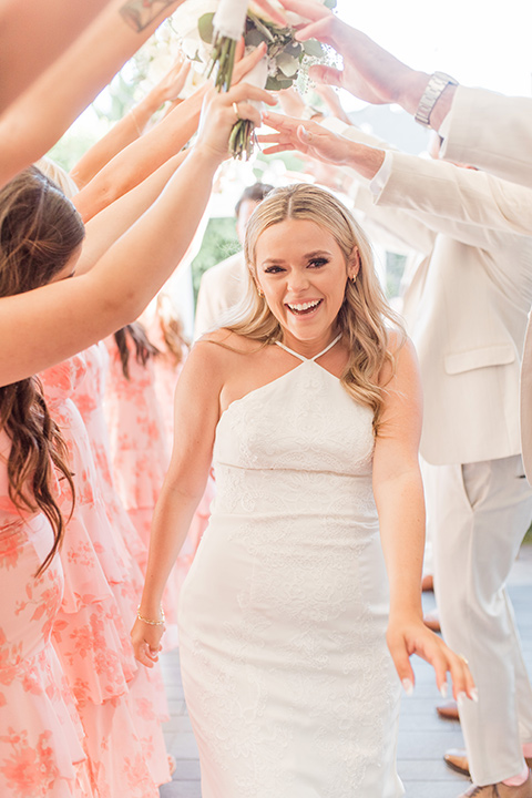  tan and pink garden wedding with floral bridesmaid dresses and the groom and groomsmen in tan suits – tunnel 