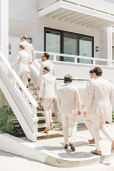  tan and pink garden wedding with floral bridesmaid dresses and the groom and groomsmen in tan suits – groomsmen 