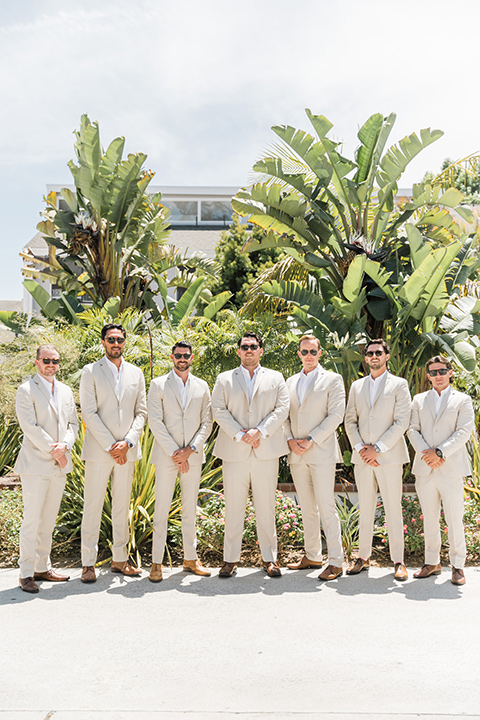  tan and pink garden wedding with floral bridesmaid dresses and the groom and groomsmen in tan suits – groomsmen 