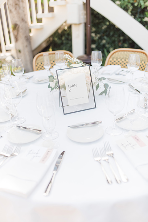  tan and pink garden wedding with floral bridesmaid dresses and the groom and groomsmen in tan suits – table and flatware 