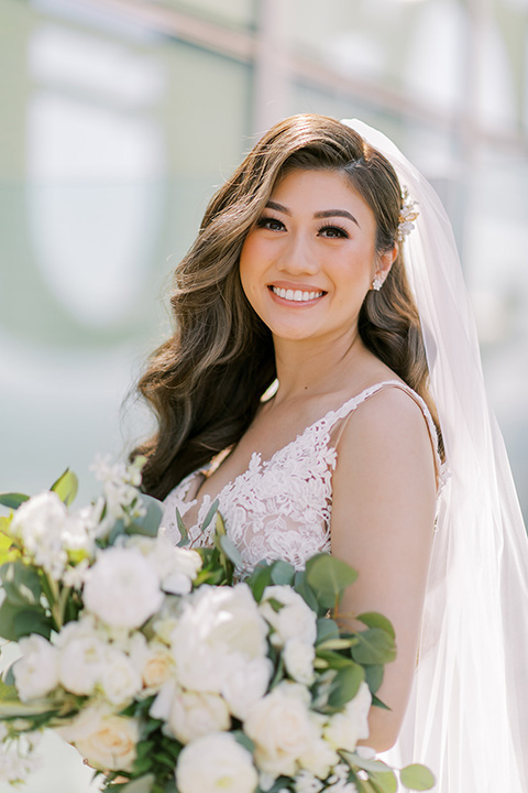  A city wedding with the guys in burgundy and black tuxedos and the bridesmaids in blush dresses- bride in her wedding dress 