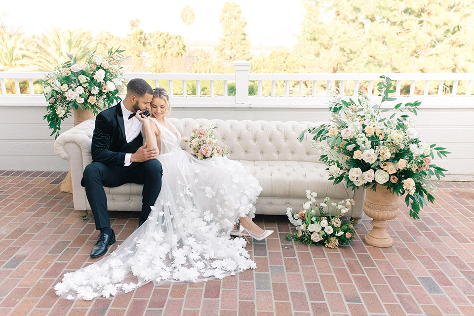  caramel mountain wedding with  black tie flare and the groom in a black velvet tuxedo – couple on couch