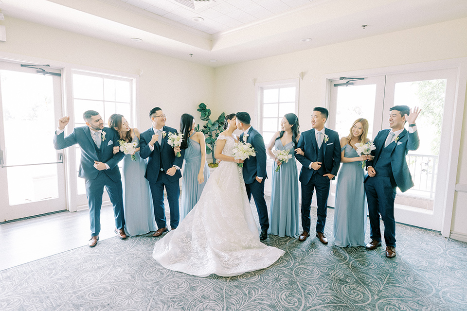  navy and white garden wedding with the groom in a navy suit and the bride in a white ballgown – bridalparty 