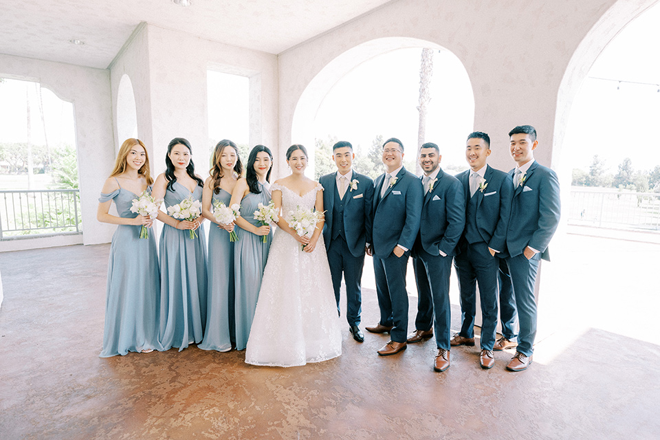  navy and white garden wedding with the groom in a navy suit and the bride in a white ballgown – bridalparty 