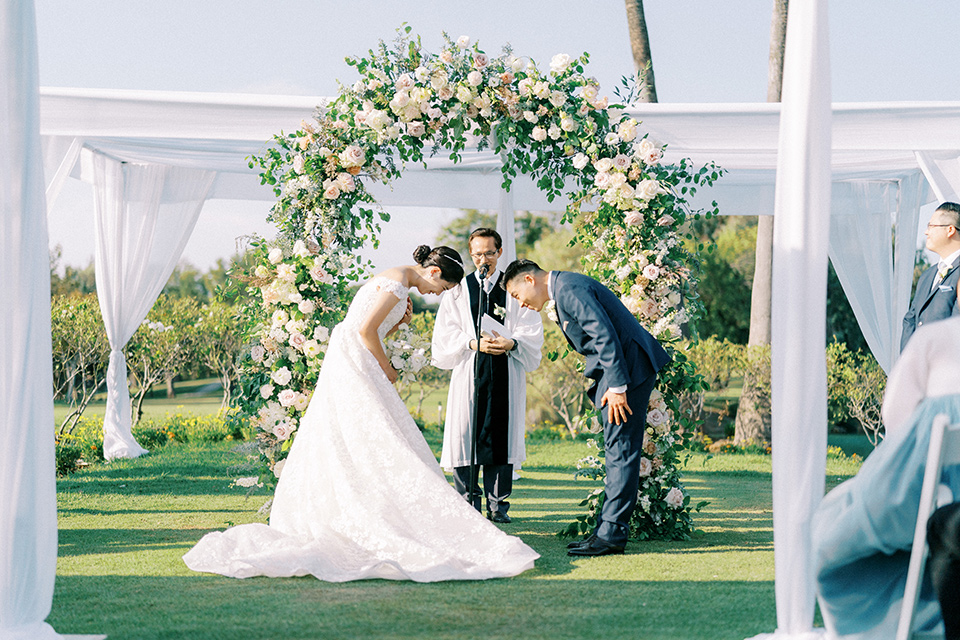  navy and white garden wedding with the groom in a navy suit and the bride in a white ballgown – ceremony 