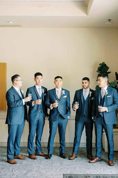  navy and white garden wedding with the groom in a navy suit and the bride in a white ballgown – groomsmen 