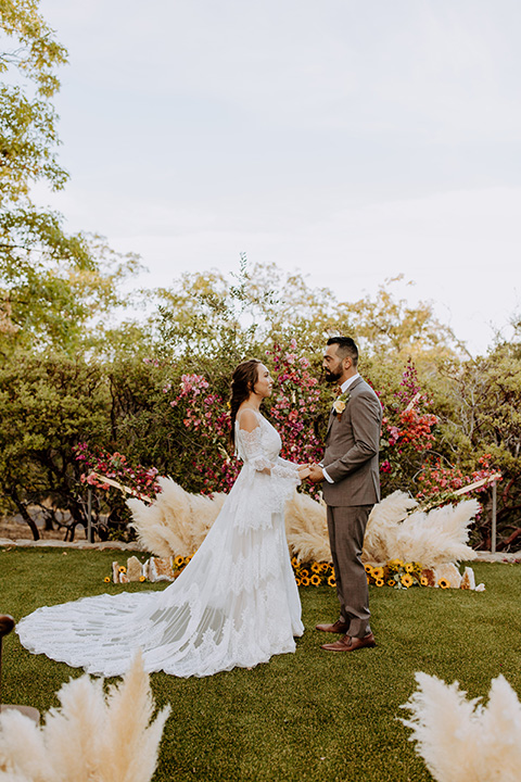  rustic bohemian wedding with brown and gold color scheme – couple at ceremony 