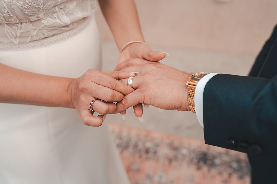  hangar 21 fullerton wedding with navy and bohemian style – exchanging rings 