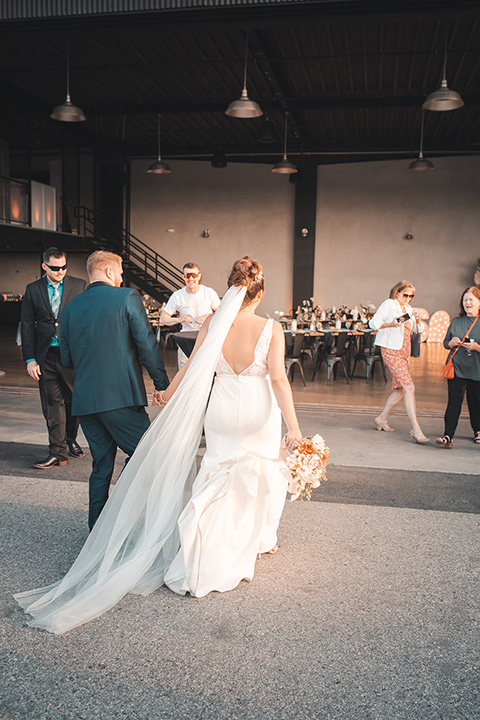  hangar 21 fullerton wedding with navy and bohemian style – walking into the wedding 