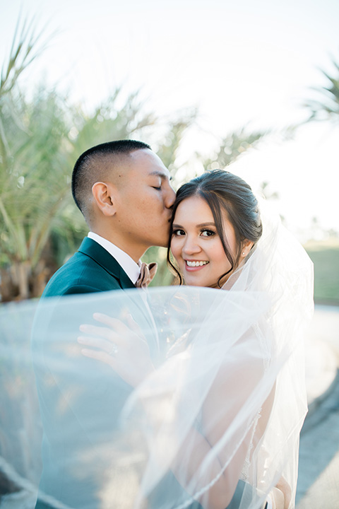  bali inspired wedding with the groom in a fun green and brown mix and match look 