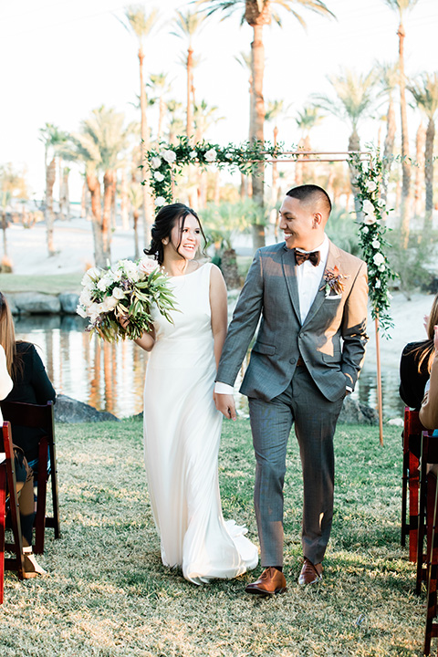  bali inspired wedding with the groom in a fun green and brown mix and match look 