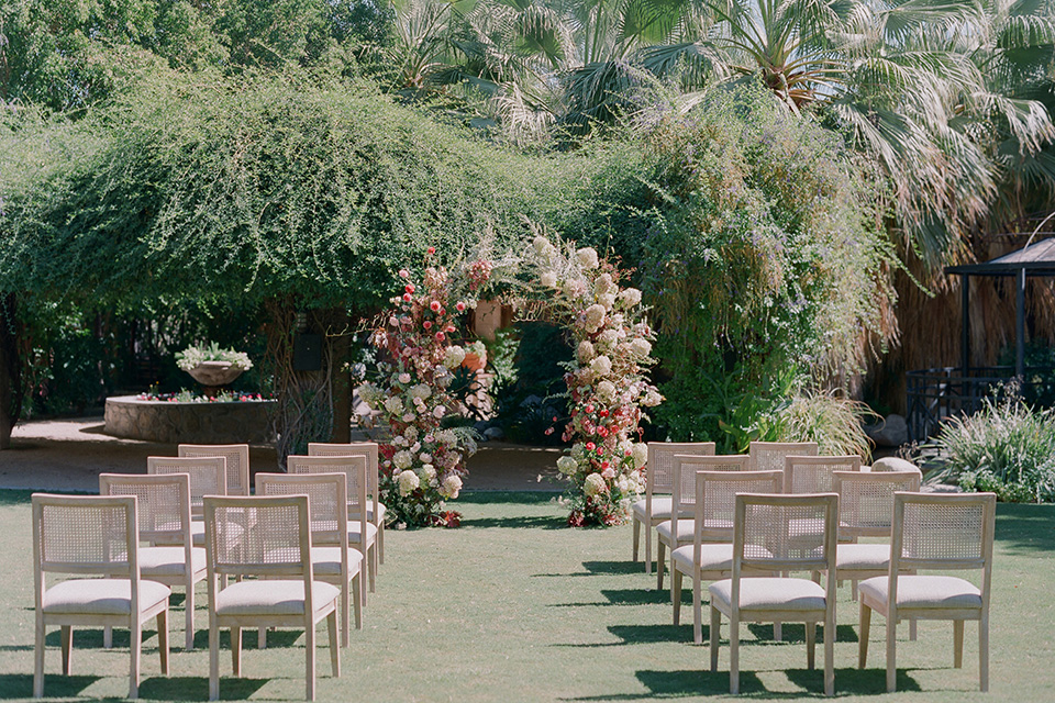  romantic wedding at colony 29 with the bride in a tulle ballgown with sleeves and the groom in a diamond black tuxedo – ceremony space   