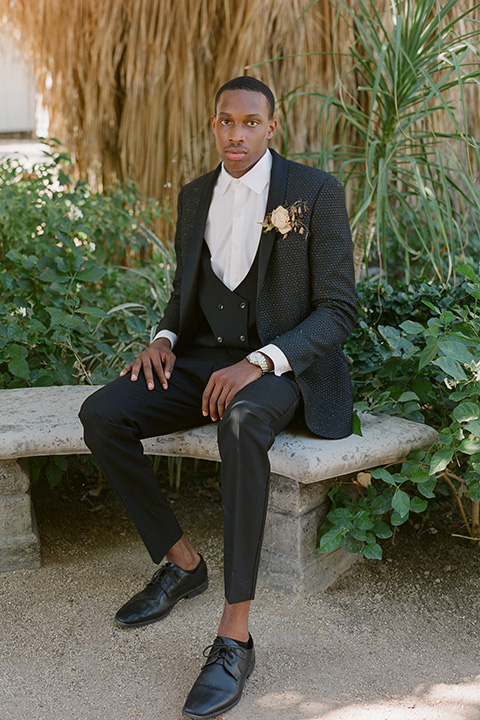  romantic wedding at colony 29 with the bride in a tulle ballgown with sleeves and the groom in a diamond black tuxedo – groom  