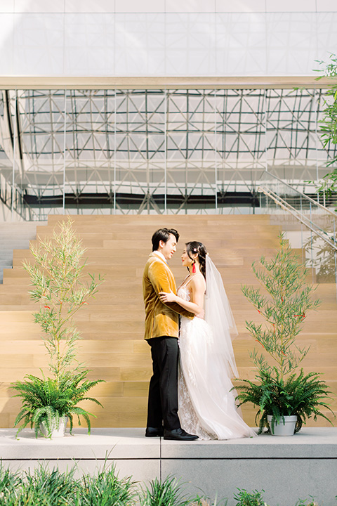  tropical and gold wedding with red accents – couple at ceremony 