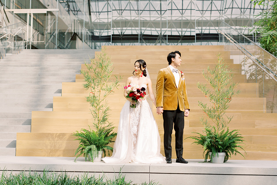  tropical and gold wedding with red accents – couple at the ceremony 