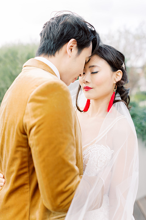  tropical and gold wedding with red accents – couple at ceremony 