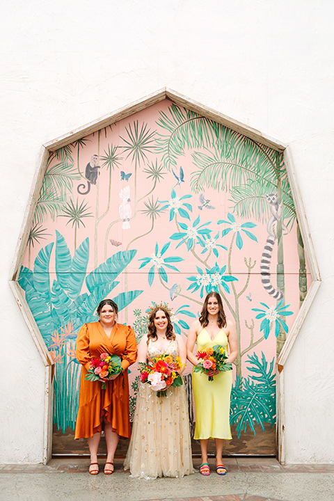  a colorful disco wedding in dtla with the bride in a champagne gown with metallic stars and the groom in a cobalt blue suit – bridesmaids 