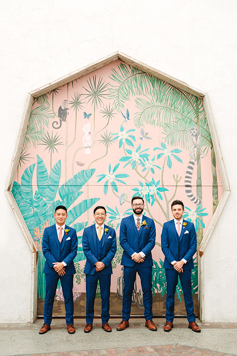  a colorful disco wedding in dtla with the bride in a champagne gown with metallic stars and the groom in a cobalt blue suit – groomsmen