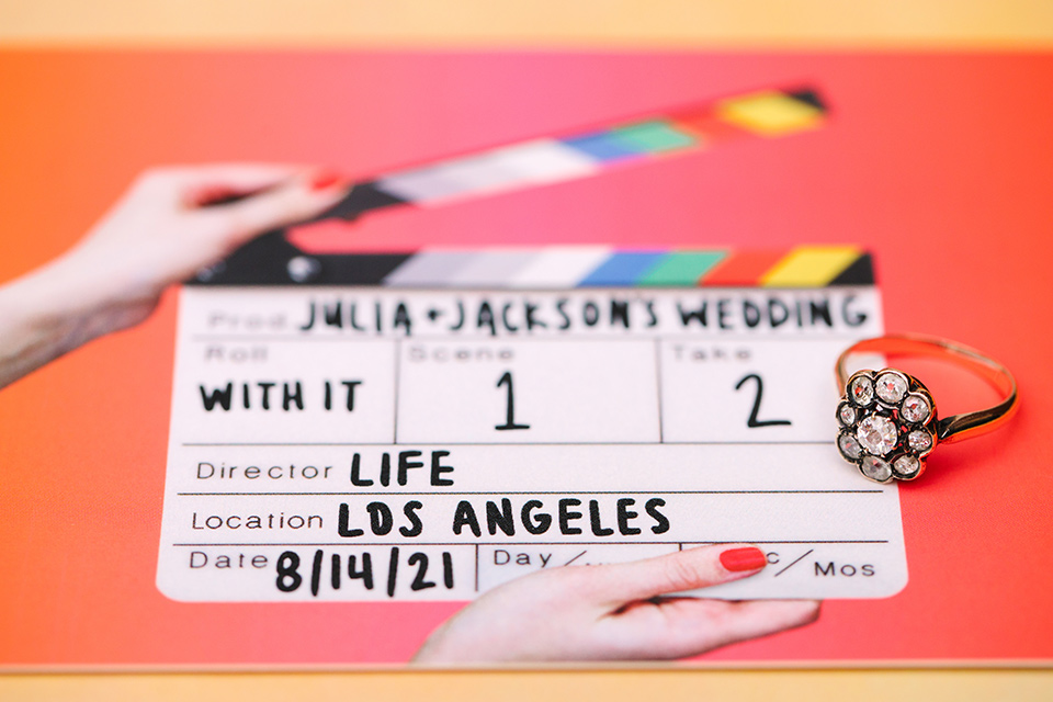  a colorful disco wedding in dtla with the bride in a champagne gown with metallic stars and the groom in a cobalt blue suit – movie marker