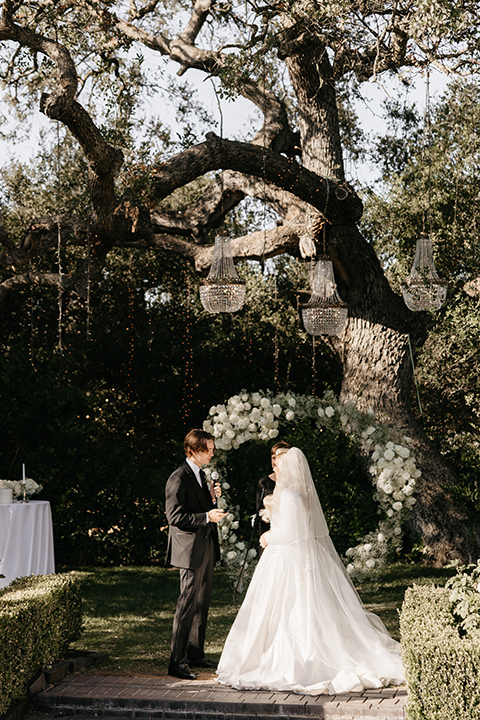  black and white wedding design with luxe details – bride and groom at the ceremony 