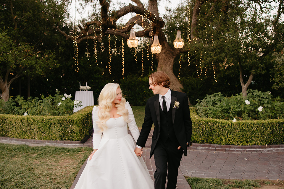  black and white wedding design with luxe details – couple walking