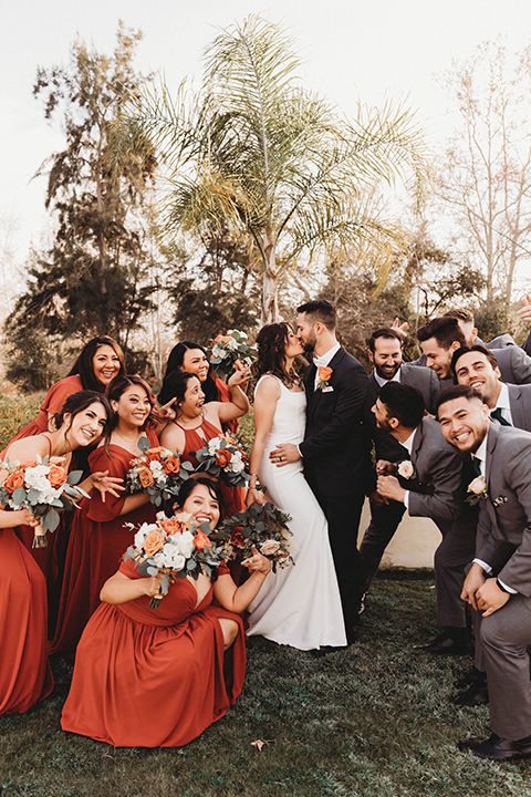  a fall toned wedding at the Fallbrook Estate Wedgewood venue with the groom and groomsmen in grey suits and the bridesmaids in orange – bridal party 