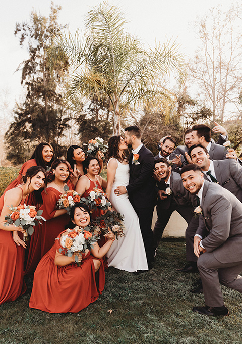  a fall toned wedding at the Fallbrook Estate Wedgewood venue with the groom and groomsmen in grey suits and the bridesmaids in orange – bridal party 
