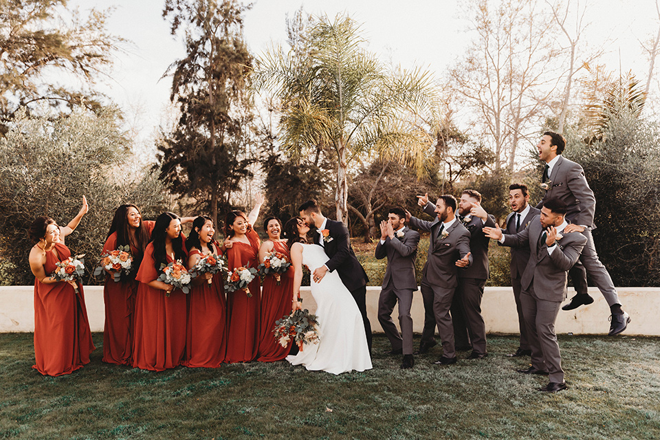  a fall toned wedding at the Fallbrook Estate Wedgewood venue with the groom and groomsmen in grey suits and the bridesmaids in orange – bridal party 