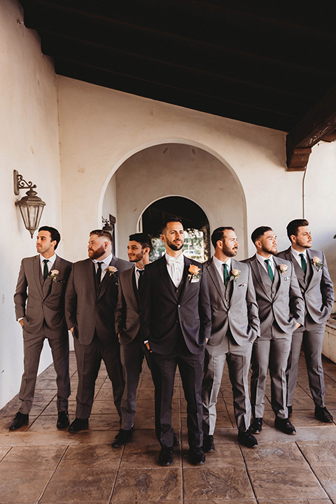  a fall toned wedding at the Fallbrook Estate Wedgewood venue with the groom and groomsmen in grey suits and the bridesmaids in orange – groom and groomsmen