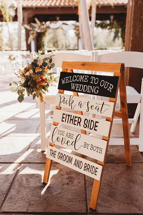  a fall toned wedding at the Fallbrook Estate Wedgewood venue with the groom and groomsmen in grey suits and the bridesmaids in orange – reception décor