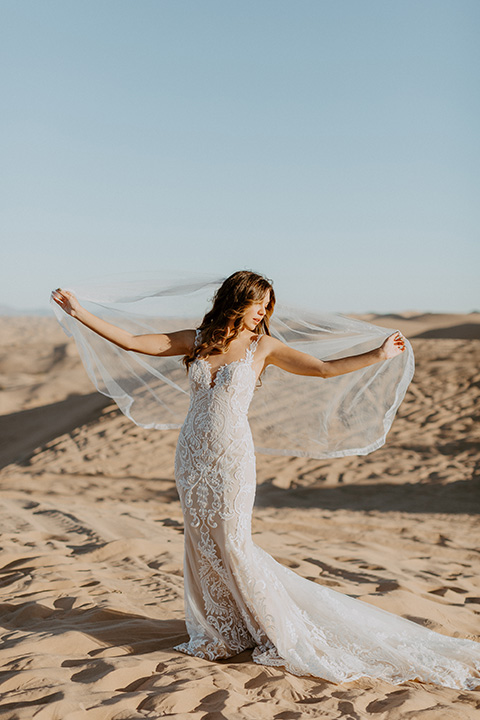  glamis sand dunes wedding with the groom in a tan and a gold velvet tuxedo at sunset - bride 