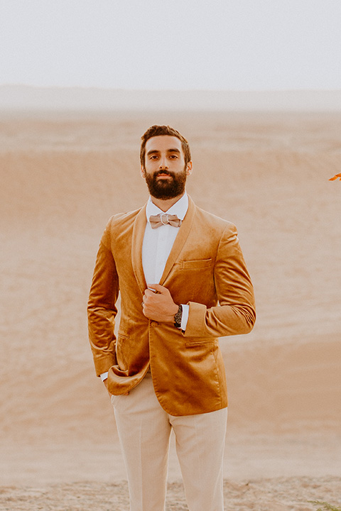  glamis sand dunes wedding with the groom in a tan and a gold velvet tuxedo at sunset – couple at ceremony 