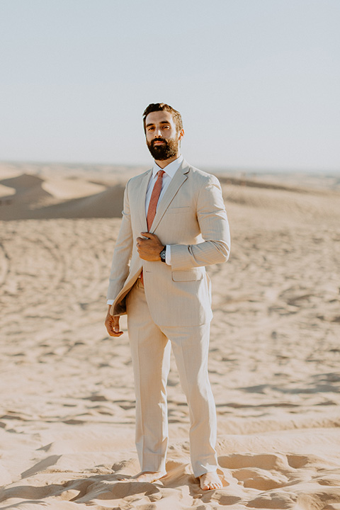  glamis sand dunes wedding with the groom in a tan and a gold velvet tuxedo at sunset – couple at ceremony 