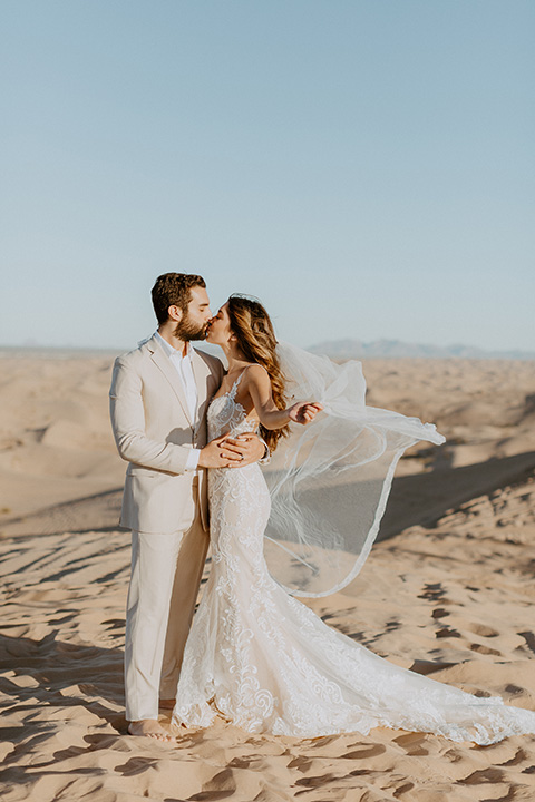  glamis sand dunes wedding with the groom in a tan and a gold velvet tuxedo at sunset – couple at ceremony 