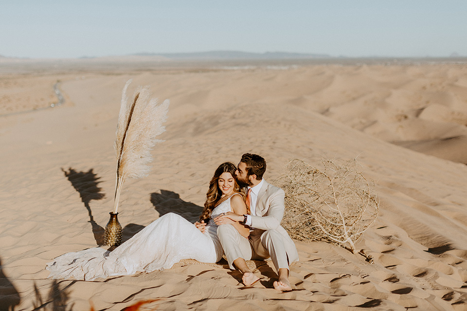  glamis sand dunes wedding with the groom in a tan and a gold velvet tuxedo at sunset – couple at ceremony